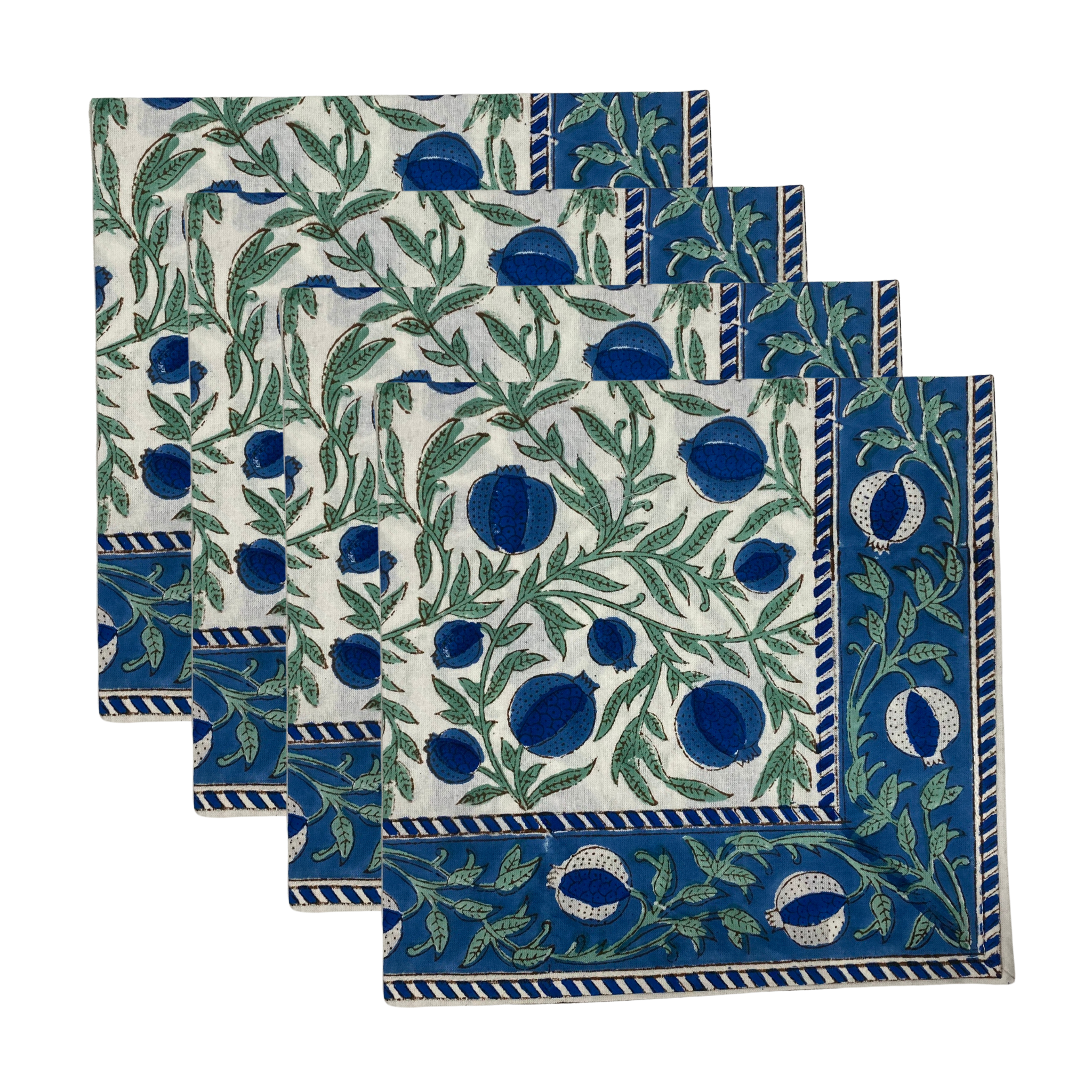 Set of four blue and green patterned napkins on a white background