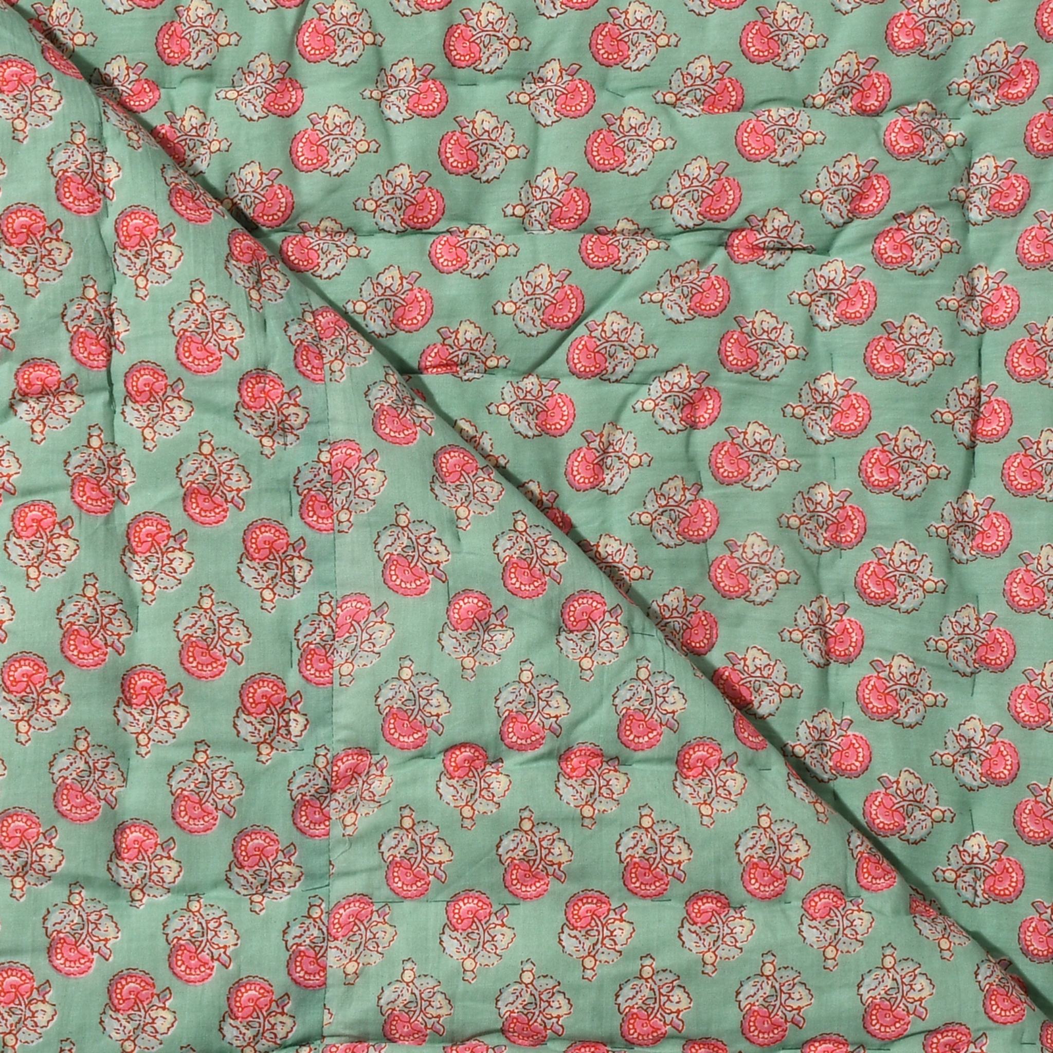 Fabric with a floral pattern on a green background