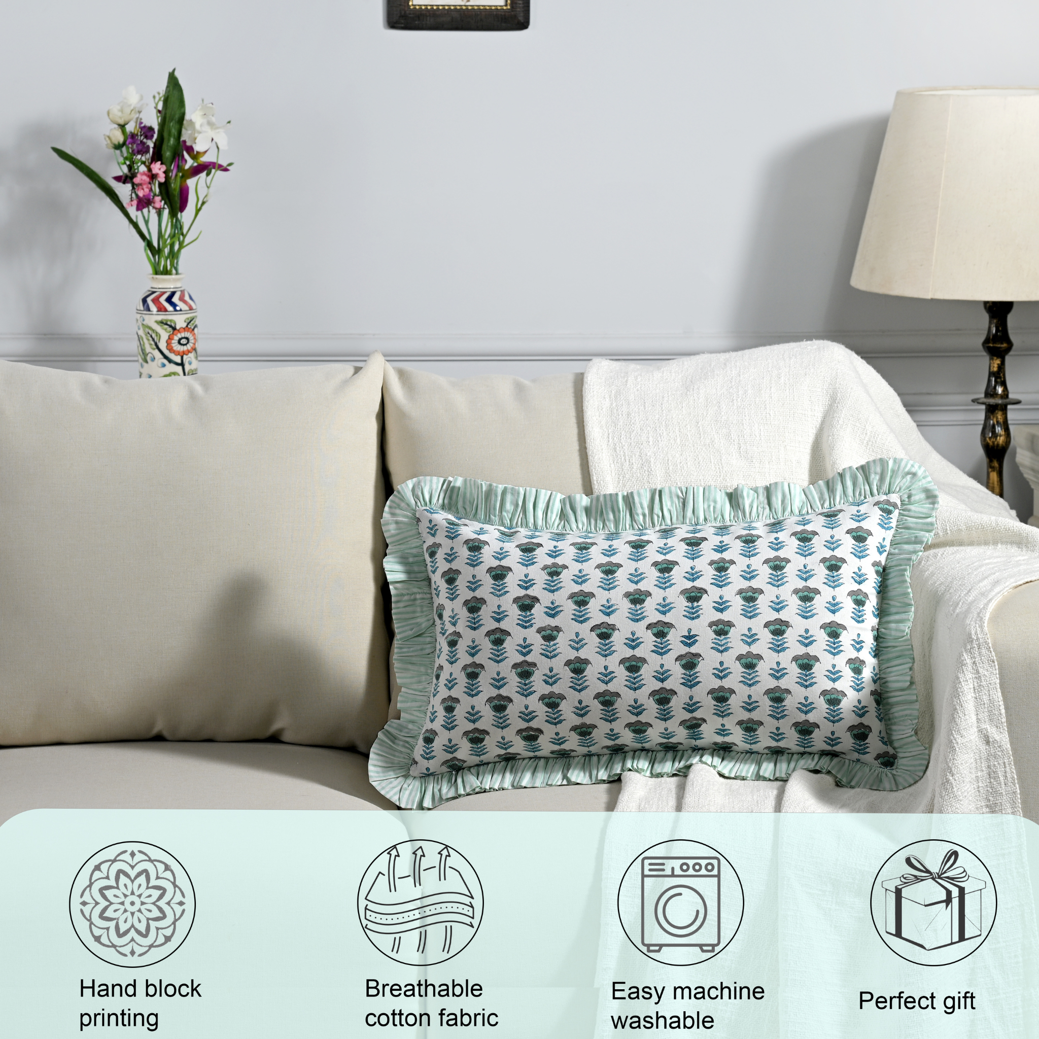 Decorative pillow on a couch with product features displayed below.