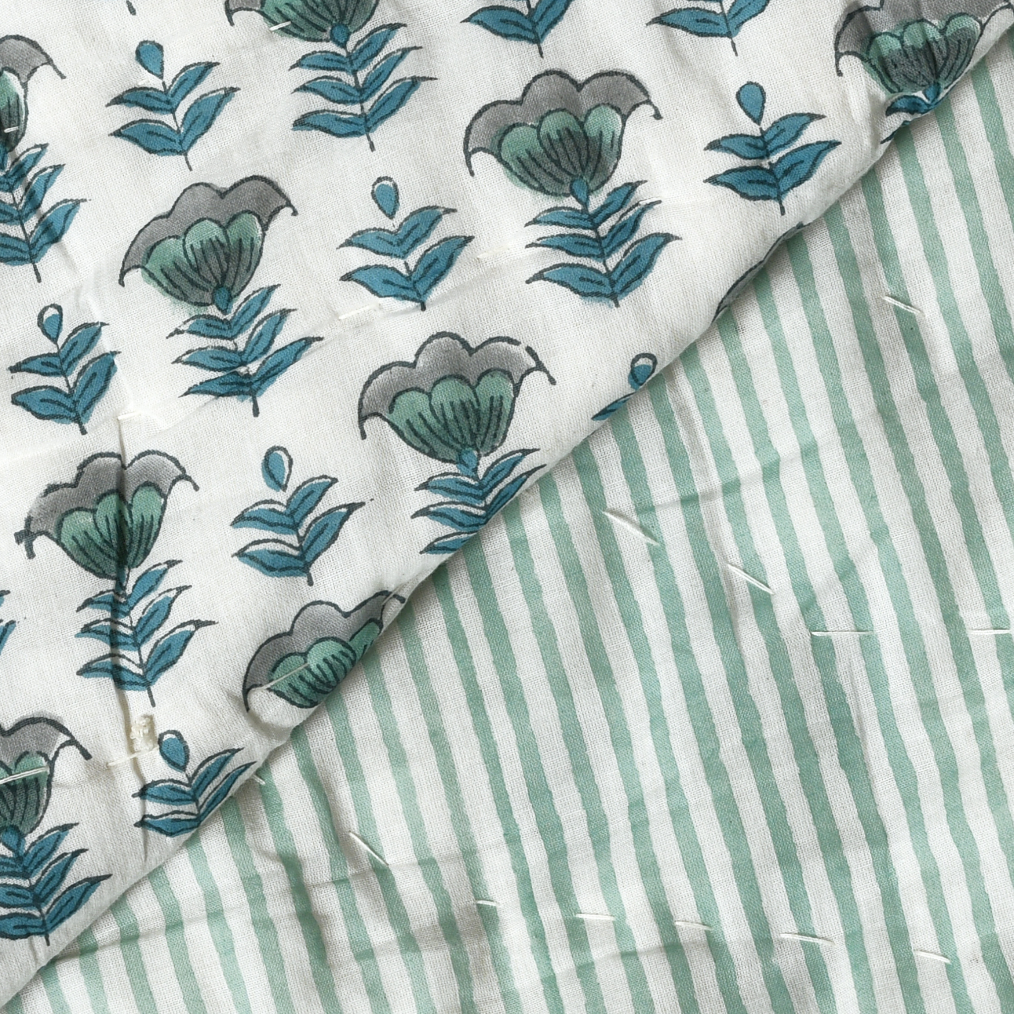 Fabric with floral and striped patterns on a white background