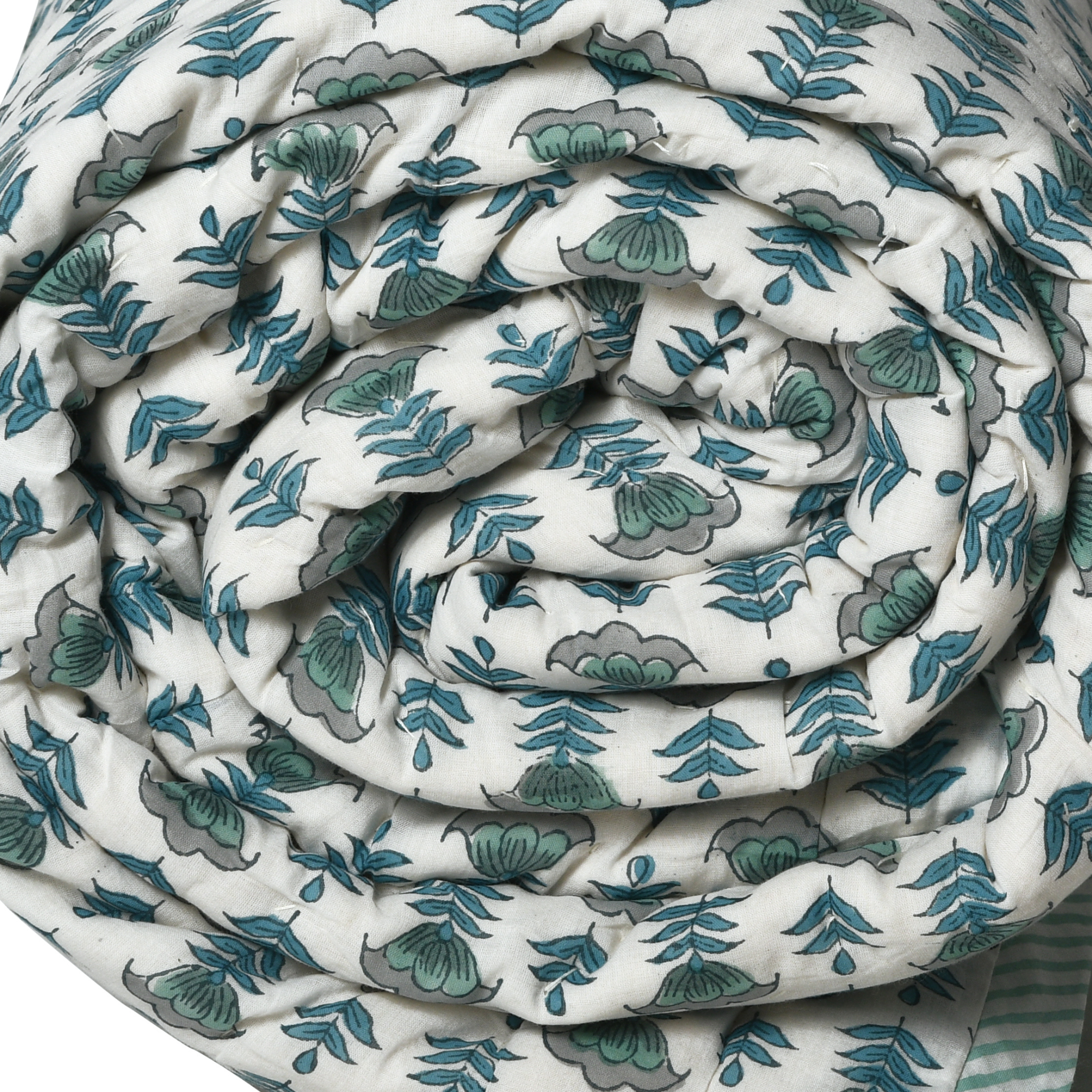 Rolled-up fabric with green leaf pattern on a white background