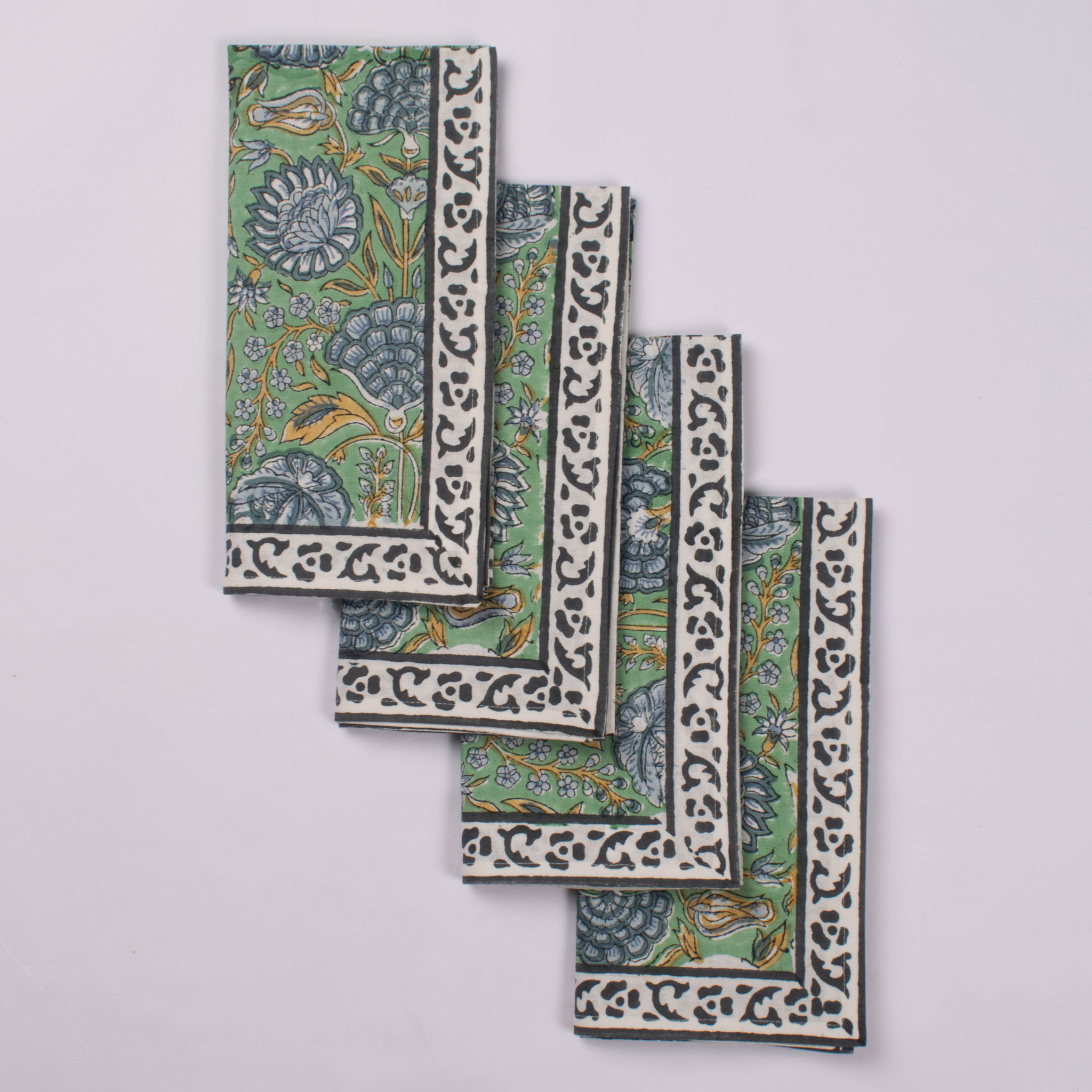 Set of decorative tiles with intricate patterns on a light gray background