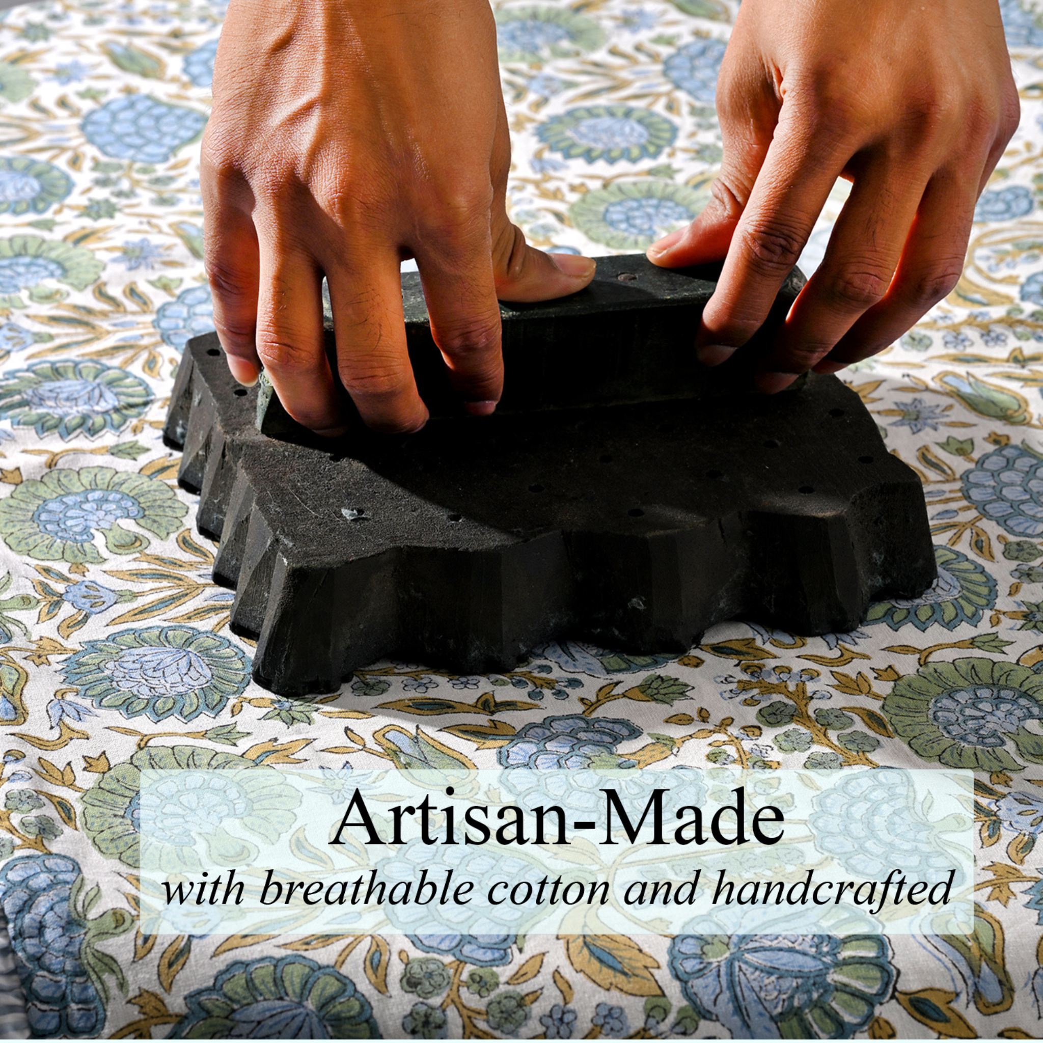 Black rubber mat with textured surface being held by hands on a floral-patterned fabric background, with 'Artisan-Made' text overlay.