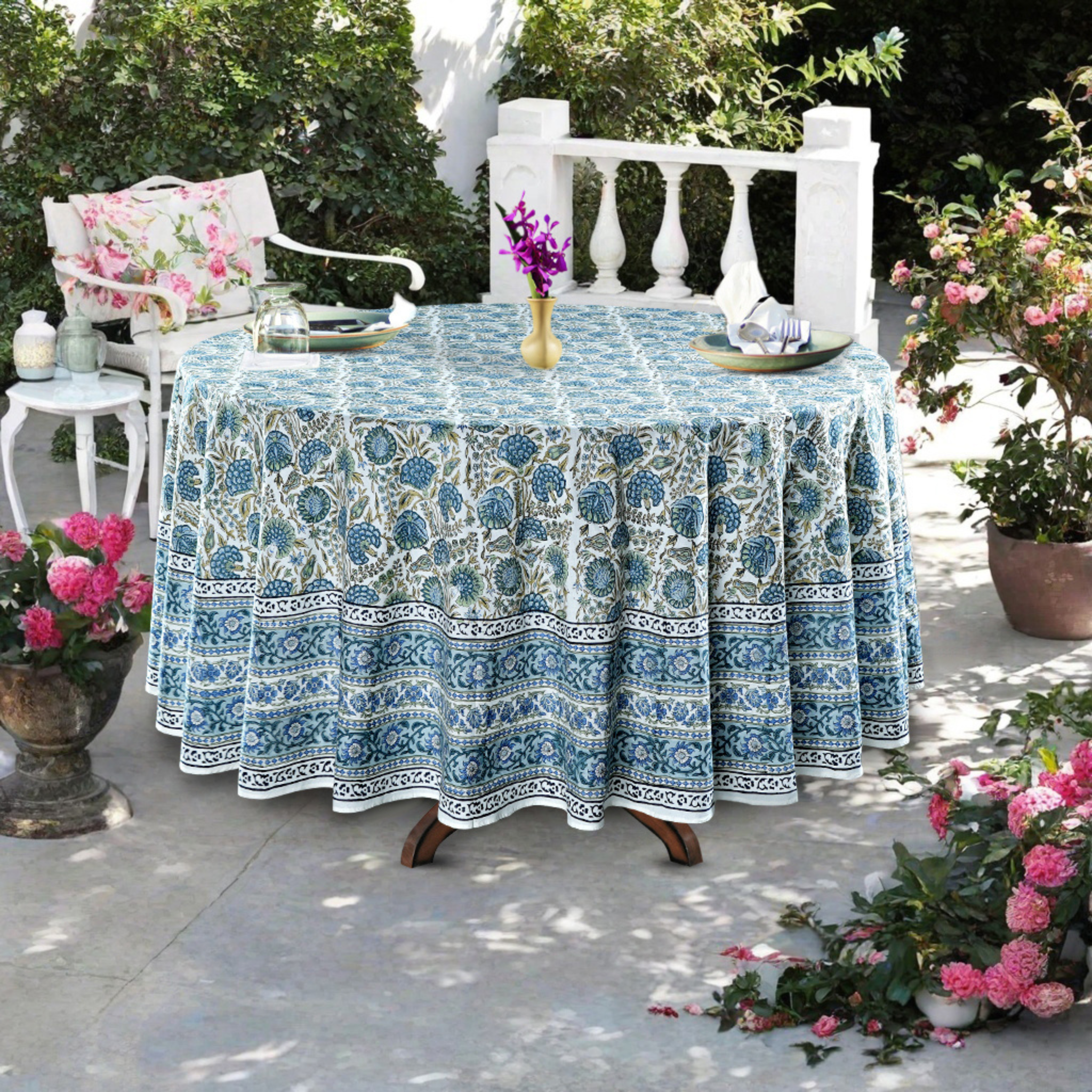 Tablecloth with blue floral pattern on a table outdoors