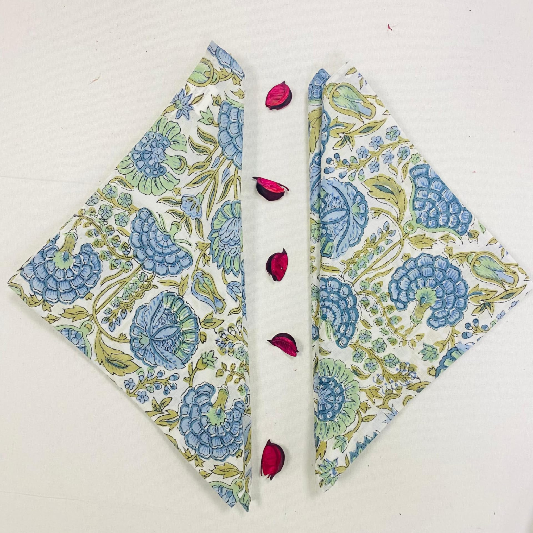 Floral patterned fabric folded in half on a white background