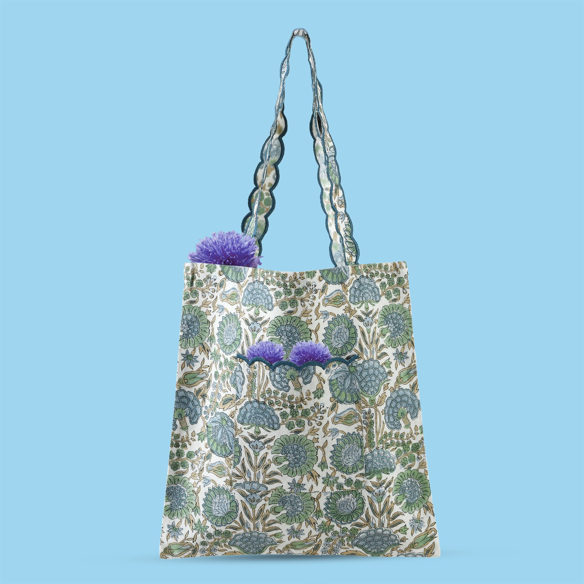 Patterned tote bag with purple flowers on a blue background