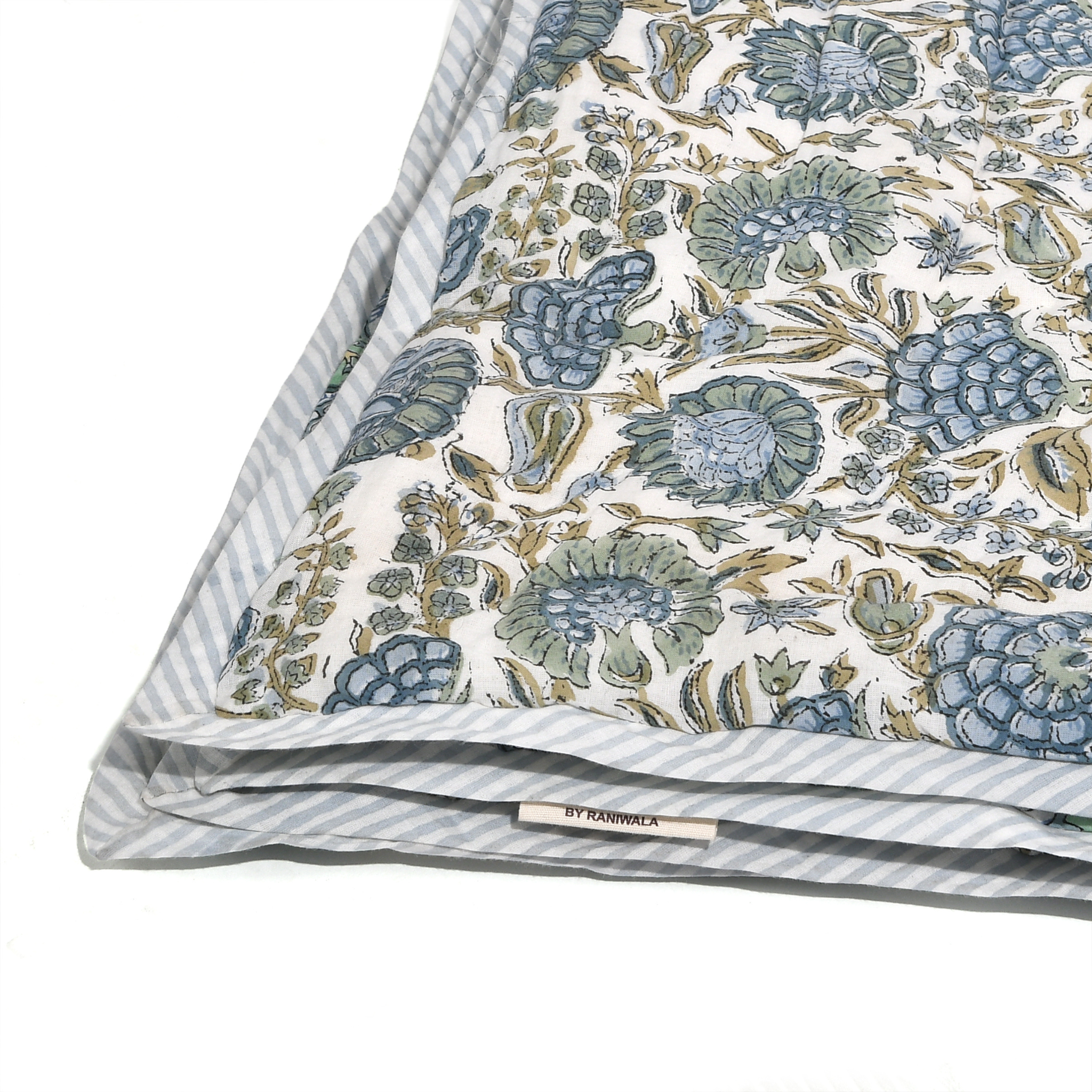 Floral patterned fabric with a striped border on a white background