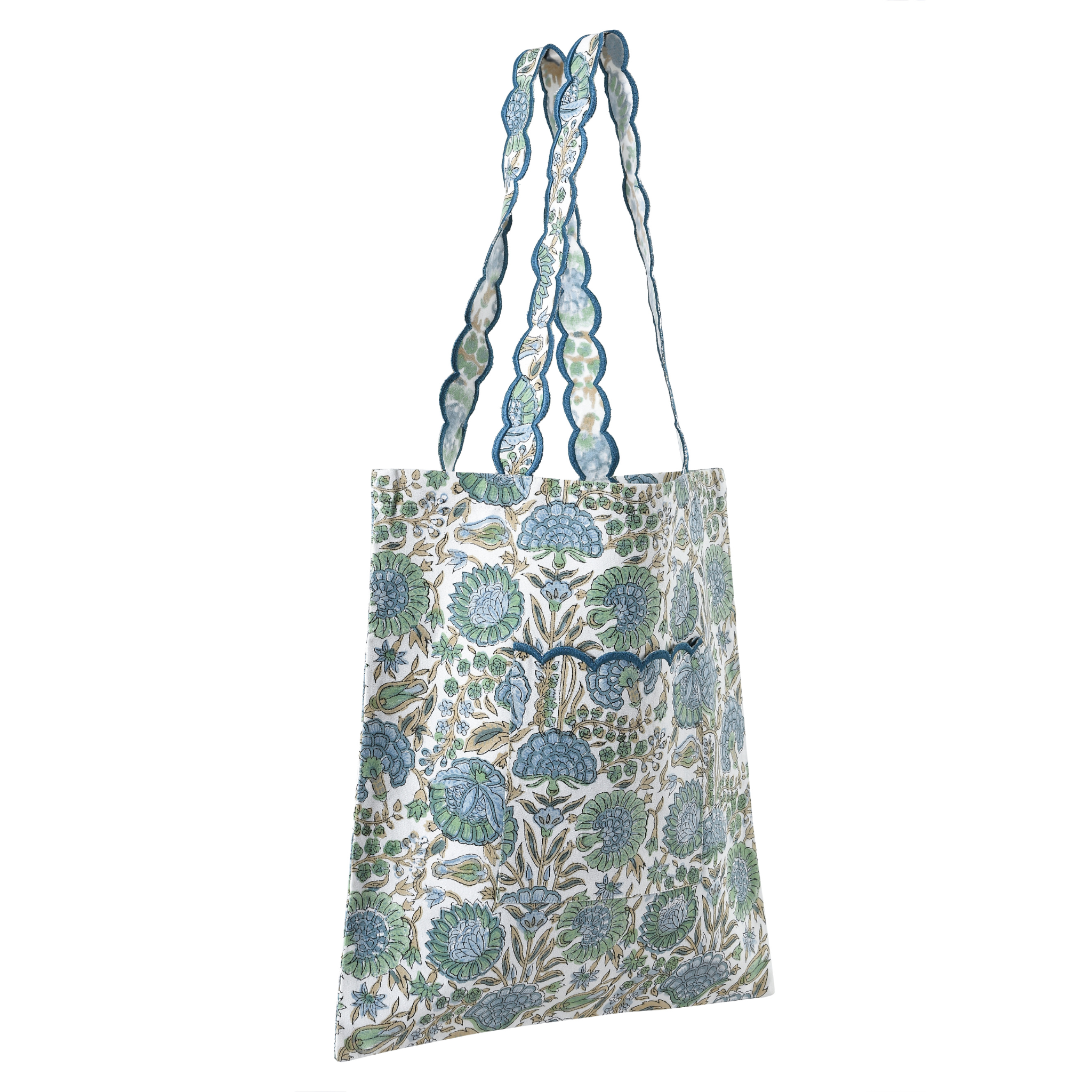 Floral patterned tote bag with decorative straps on a white background