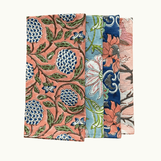 Two floral patterned fabric swatches on a white background