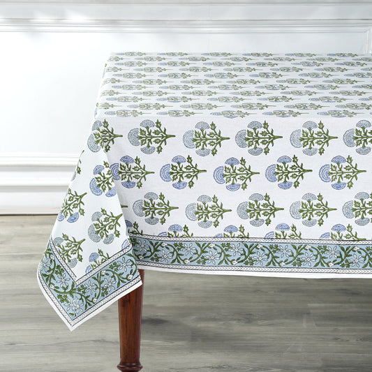 Tablecloth with green floral pattern on a wooden table