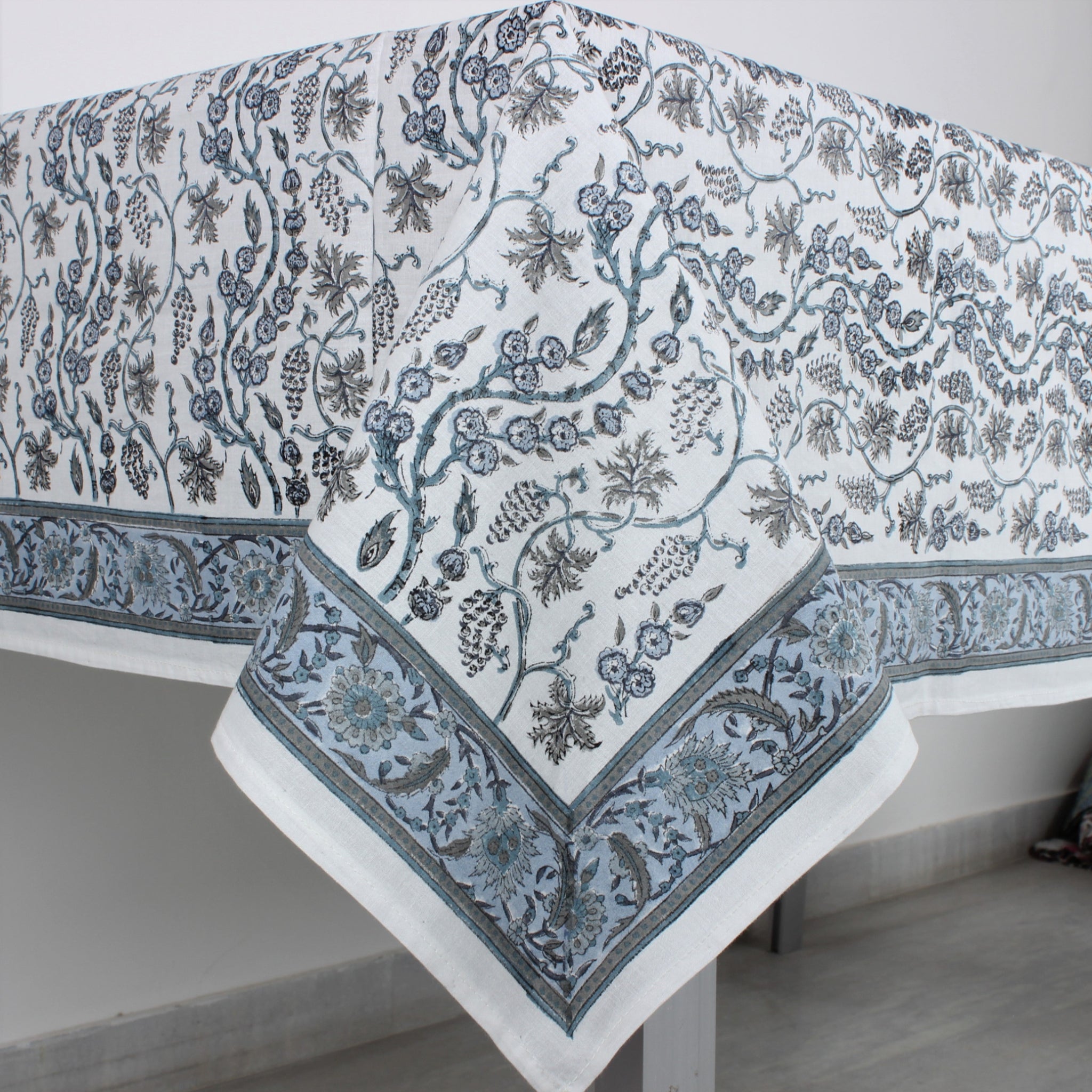 Floral patterned tablecloth on a white table