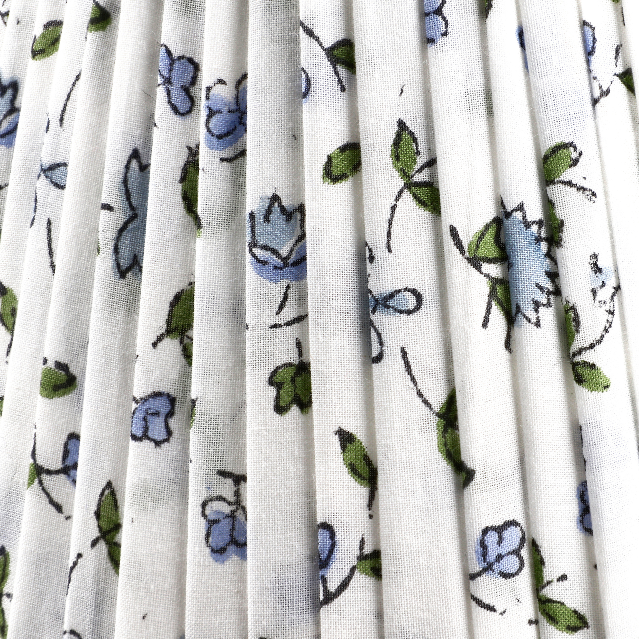 White fabric with blue and green floral pattern