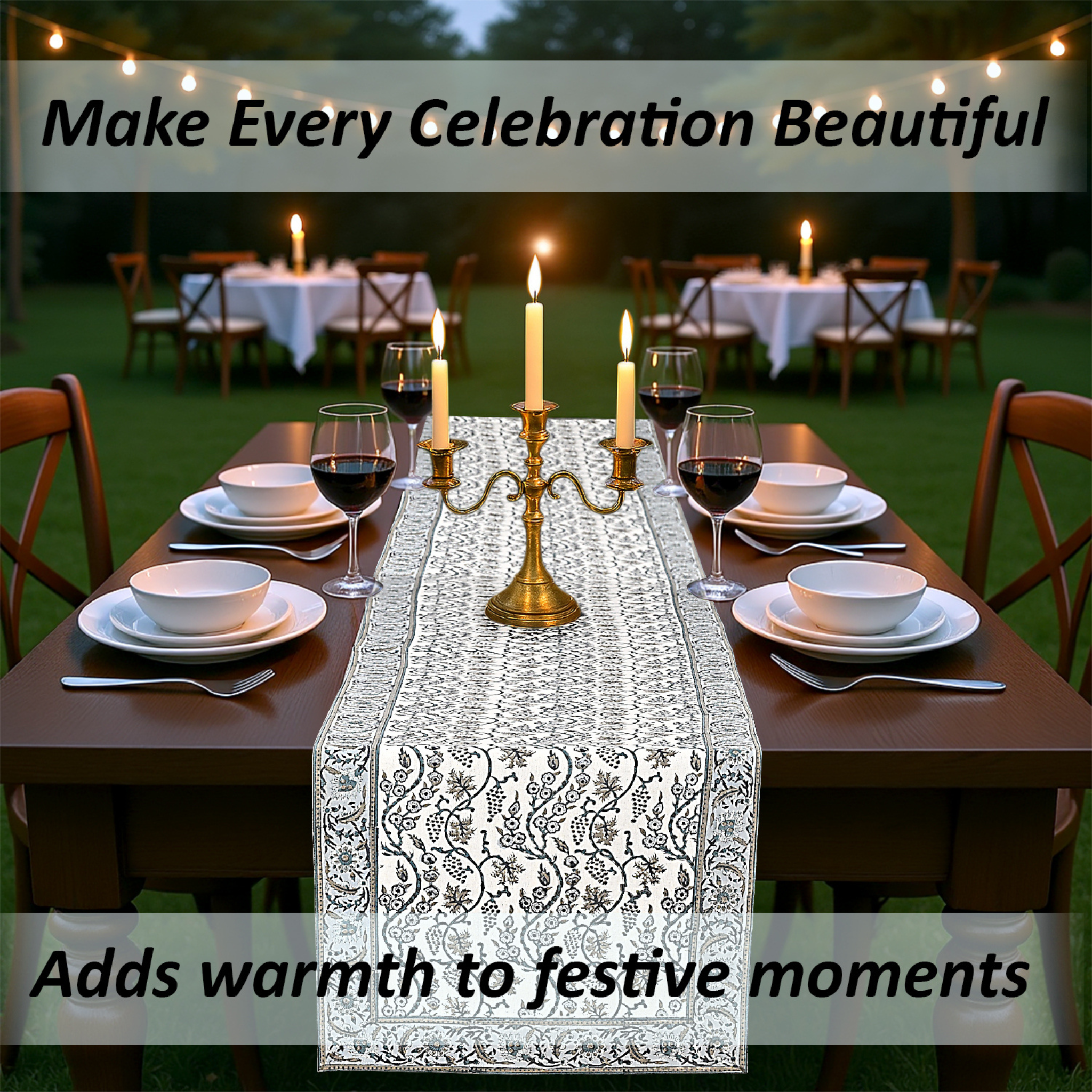 Dining table set with a decorative table runner, candles, and wine glasses outdoors.