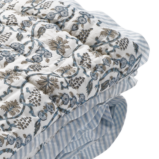 Floral and striped fabric with intricate patterns on a white background