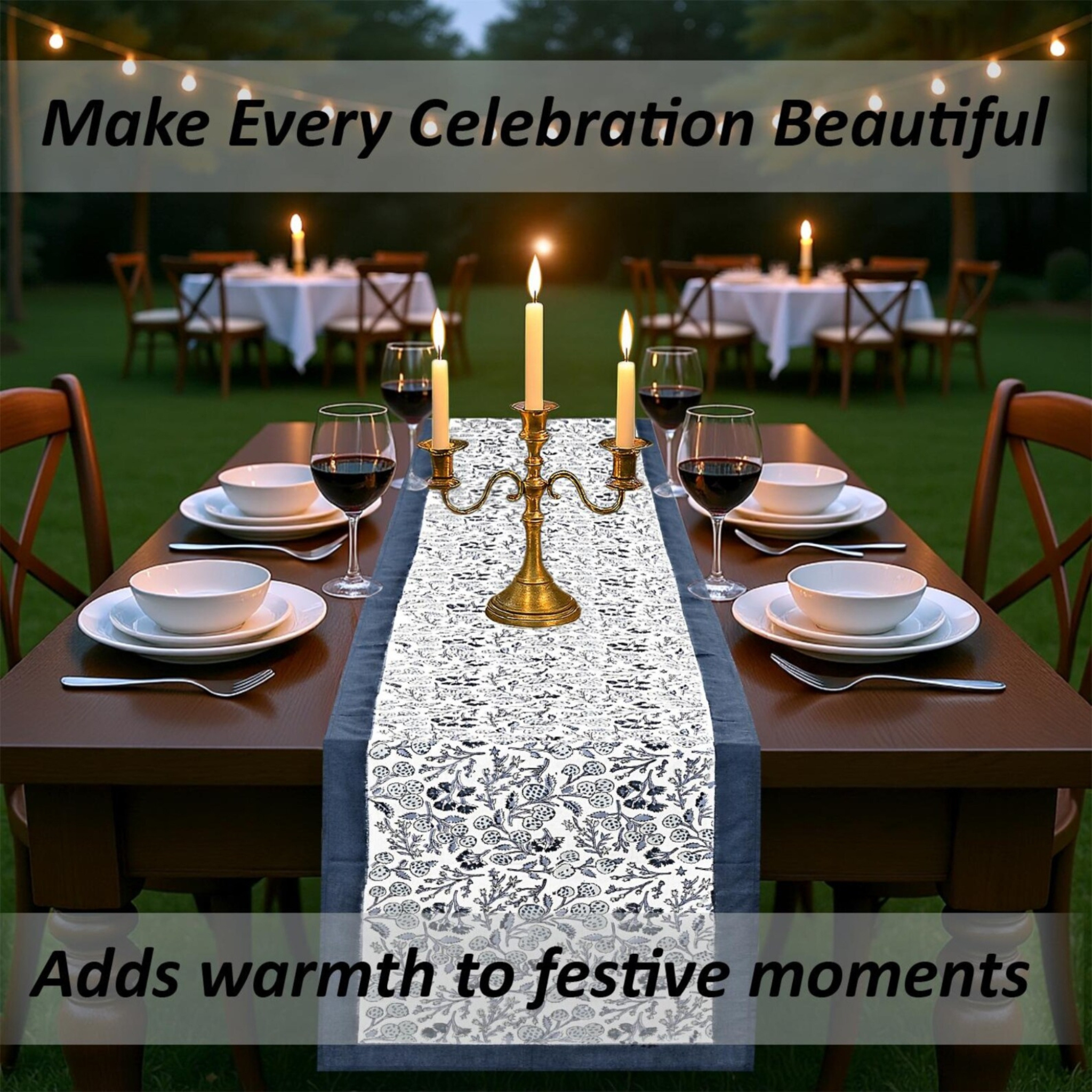 Dining table set for a celebration with candles, wine glasses, and a decorative table runner.