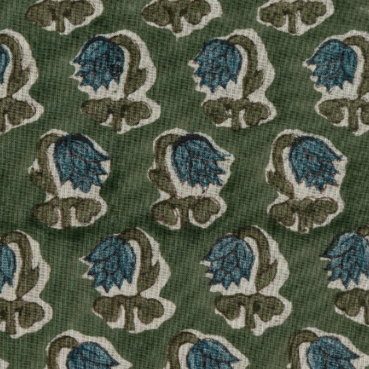 Patterned fabric with blue and brown floral design on a green background