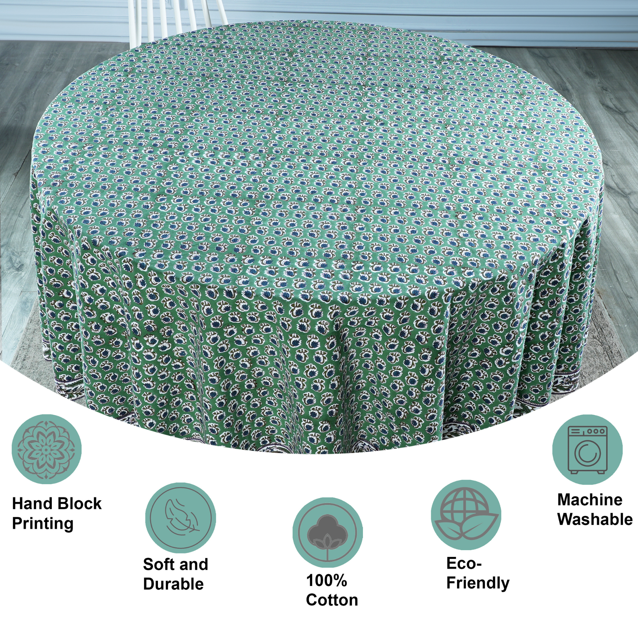 Green patterned tablecloth on a round table with features highlighted.