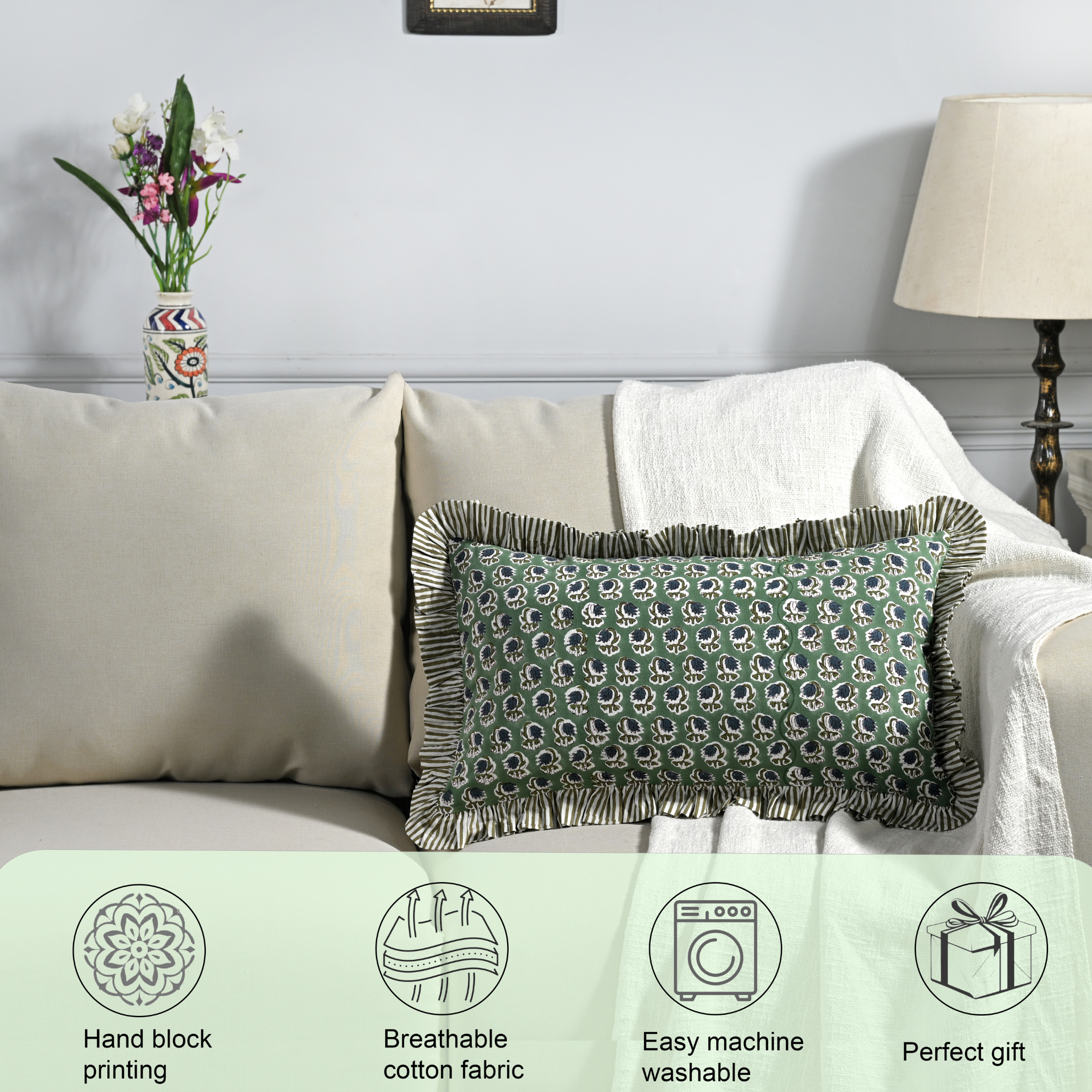 Decorative pillow on a couch with product features displayed below.