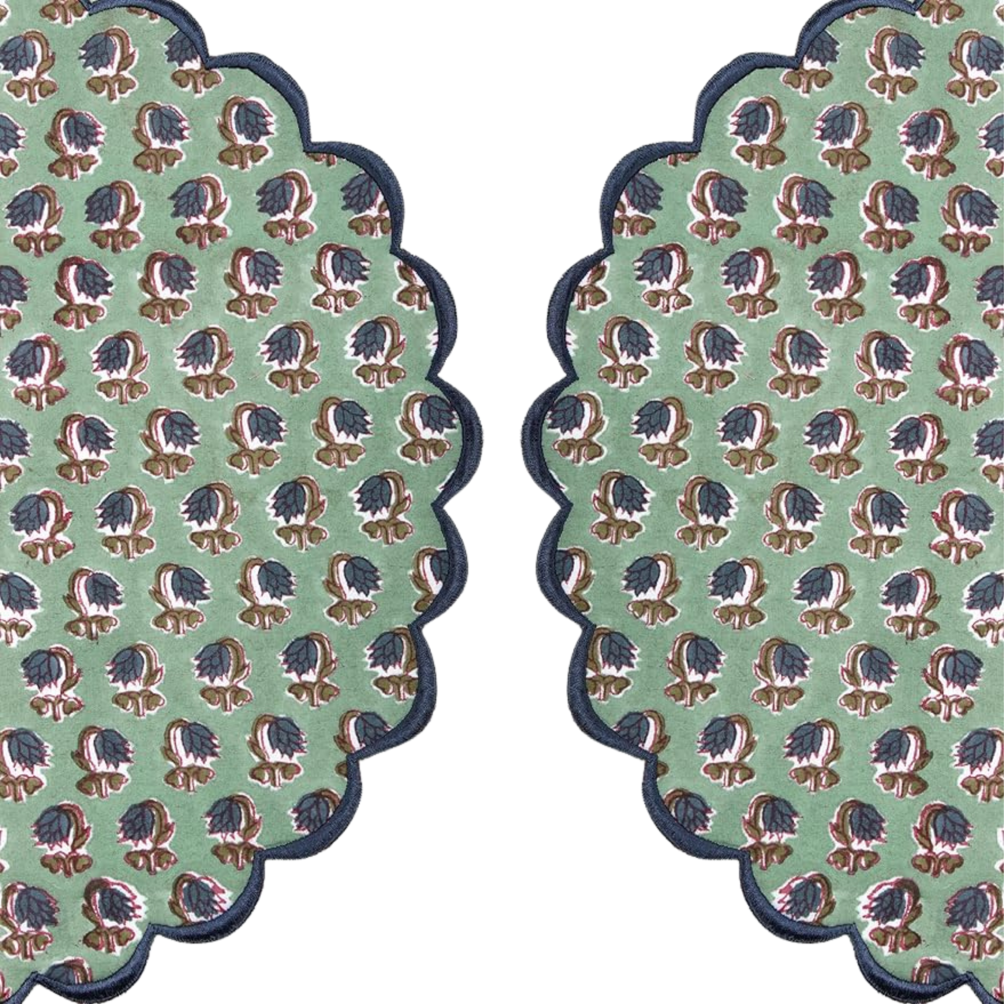 Two green patterned coasters with scalloped edges on a white background