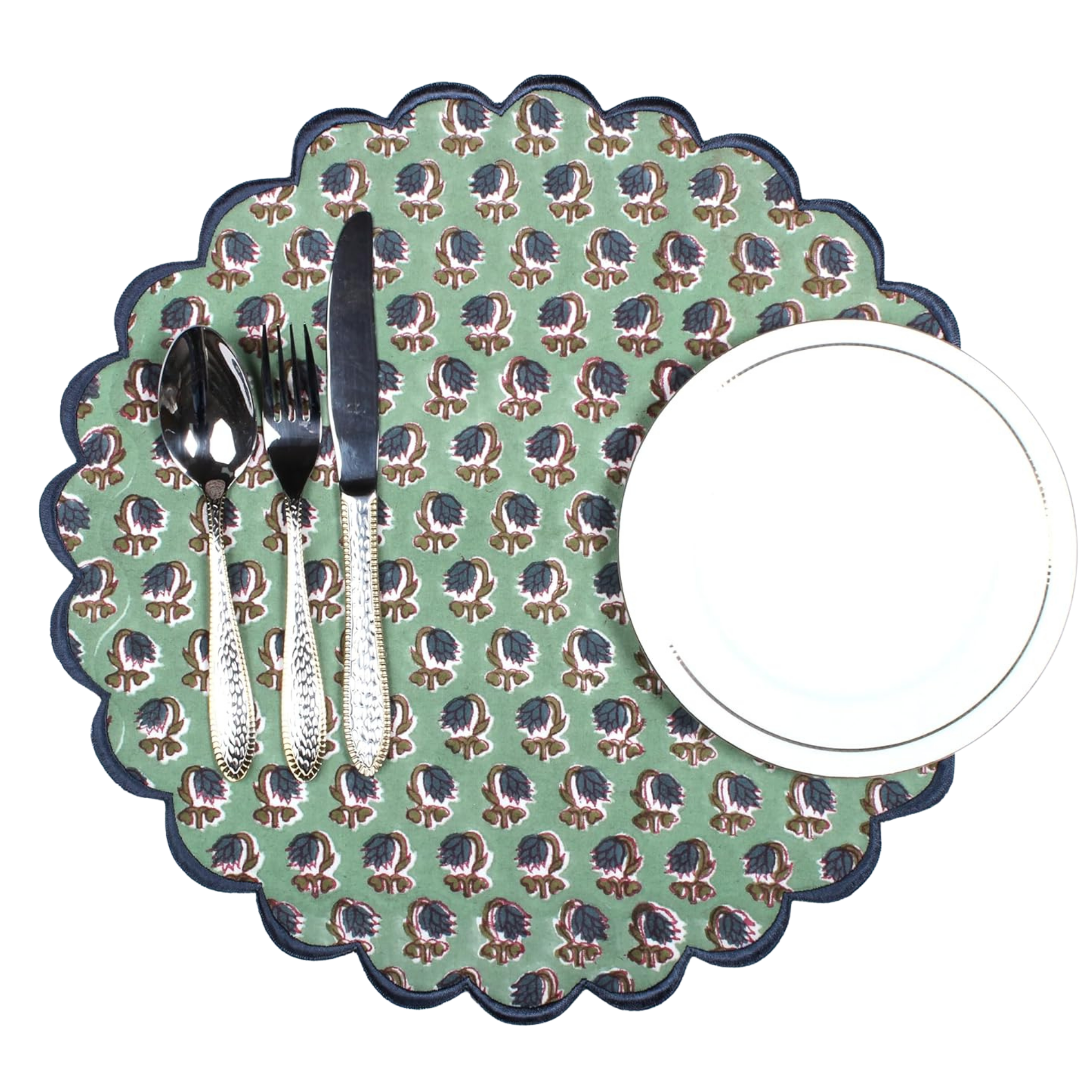 Patterned placemat with cutlery and a plate on a white background
