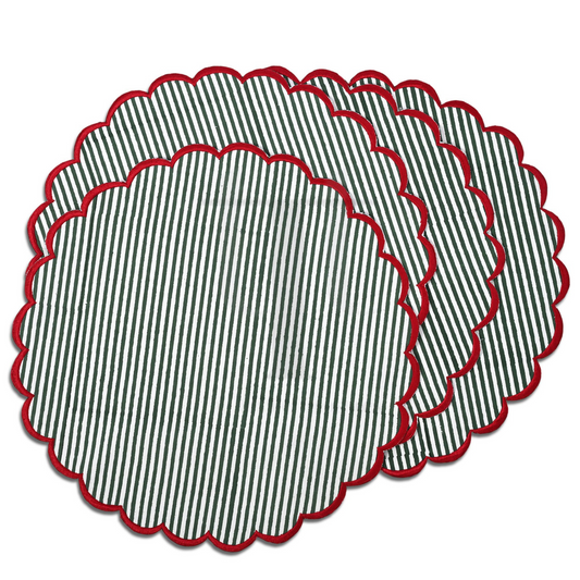 Set of round placemats with black and white striped pattern and red scalloped edge on a white background
