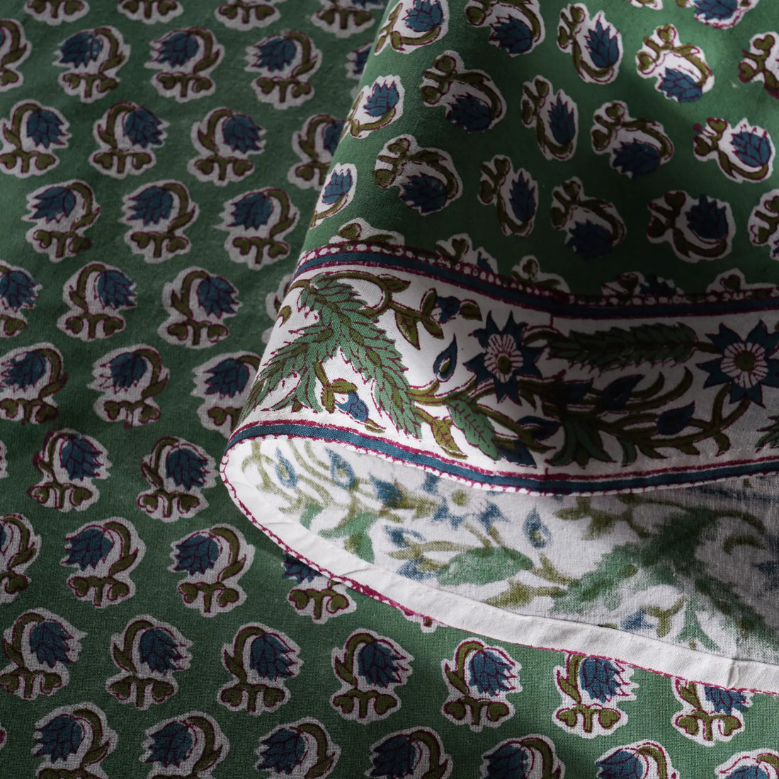 Close-up of green fabric with intricate pattern