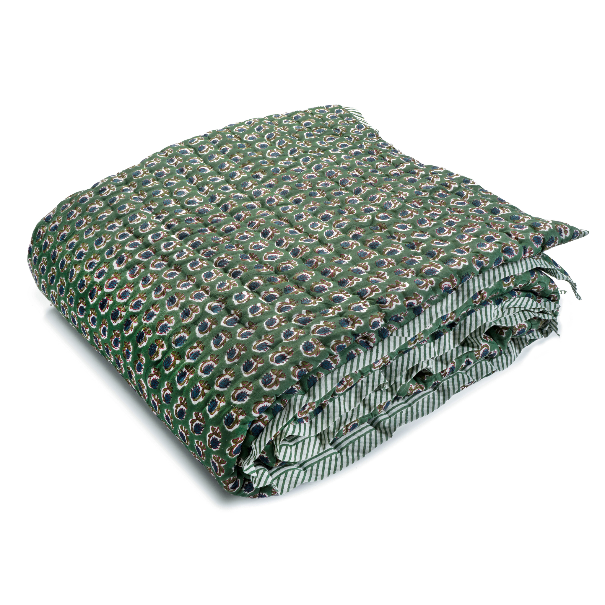 Folded green quilt with a pattern on a white background