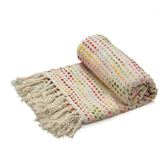 Folded blanket with colorful polka dots and tassels on a white background