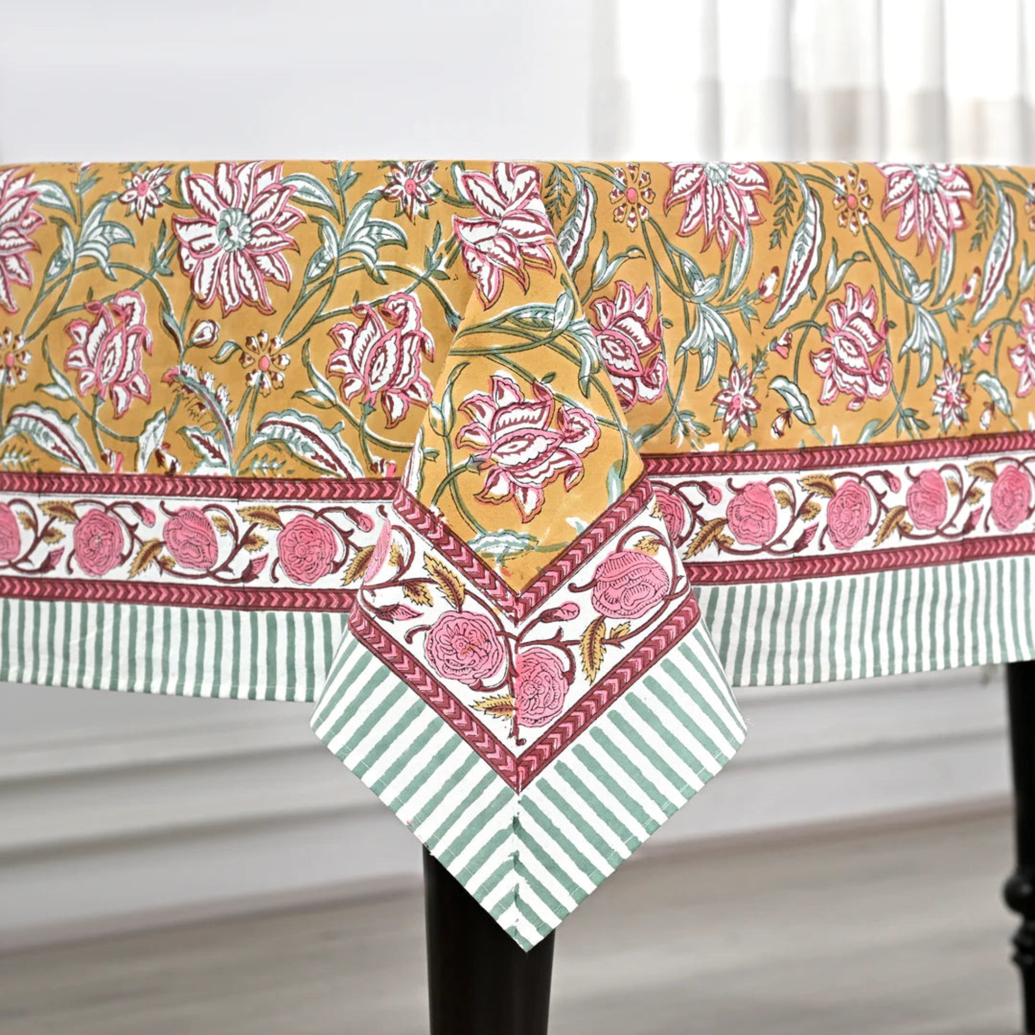 Floral and striped tablecloth on a white background