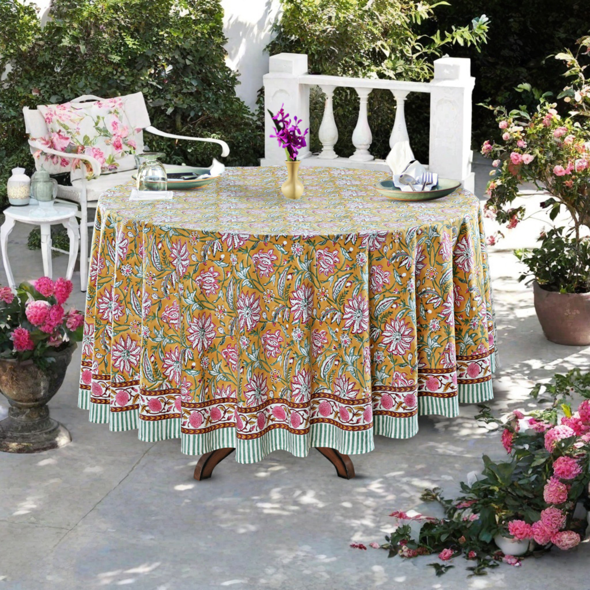 Decorative tablecloth with floral pattern on a table outdoors