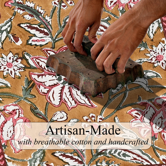 Hand using a wooden block to print a floral pattern on fabric with 'Artisan-Made' text overlay.