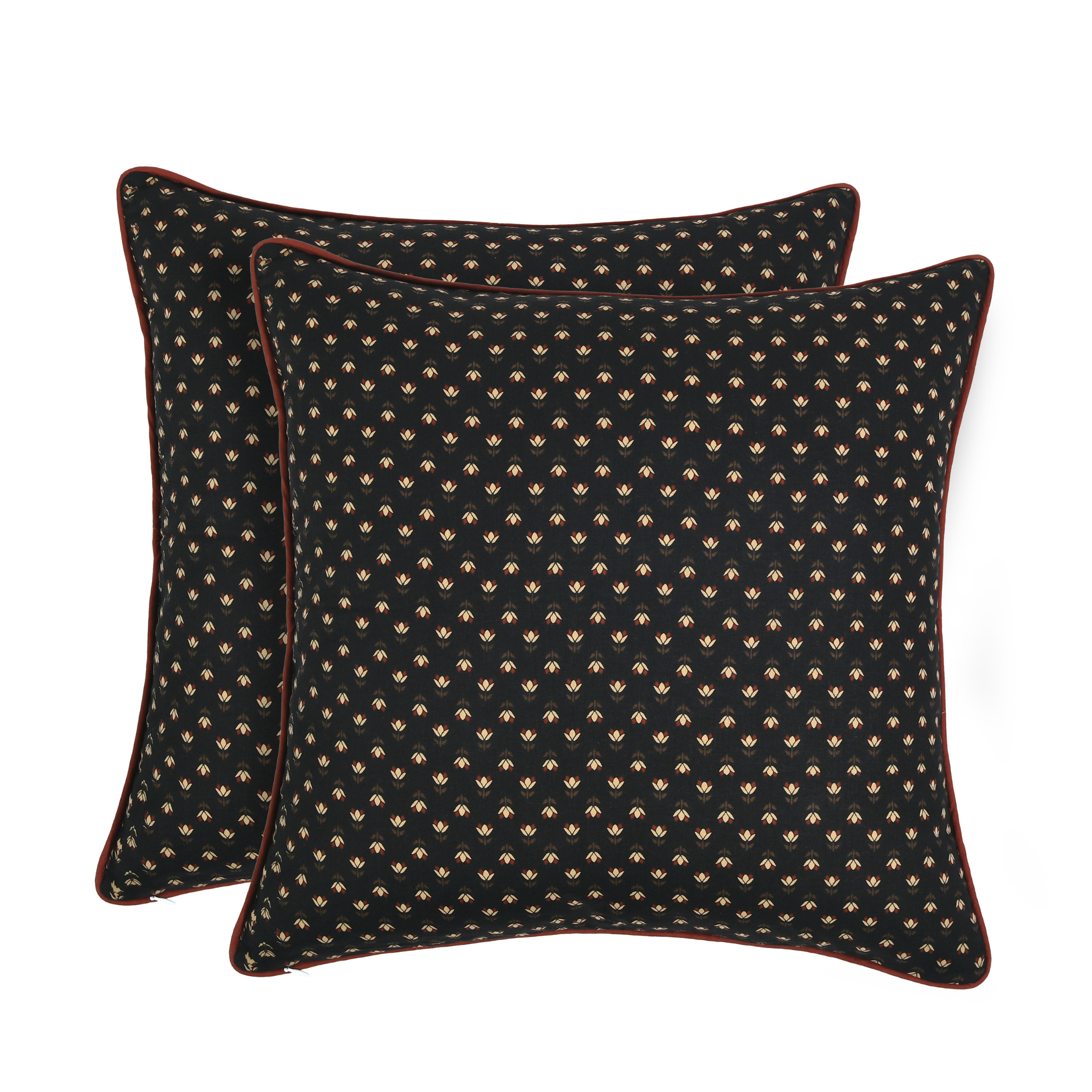 Two black patterned pillows on a white background