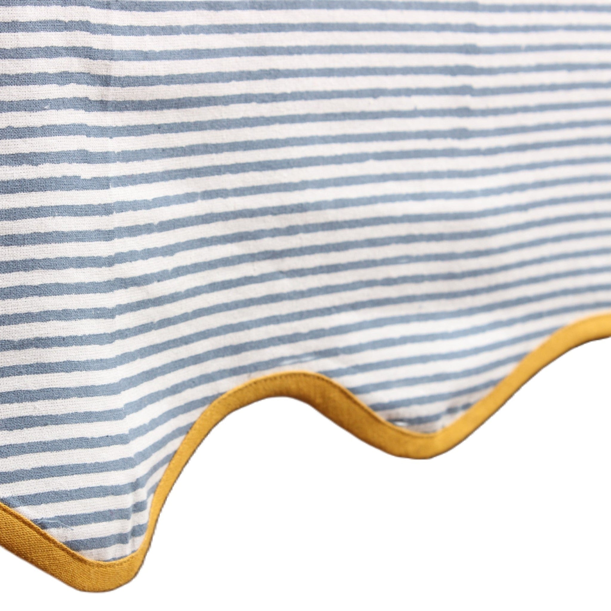 Close-up of a striped fabric with yellow trim on a white background