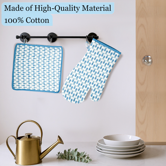Blue patterned pot holder and oven mitt hanging on a rack with kitchen items below.