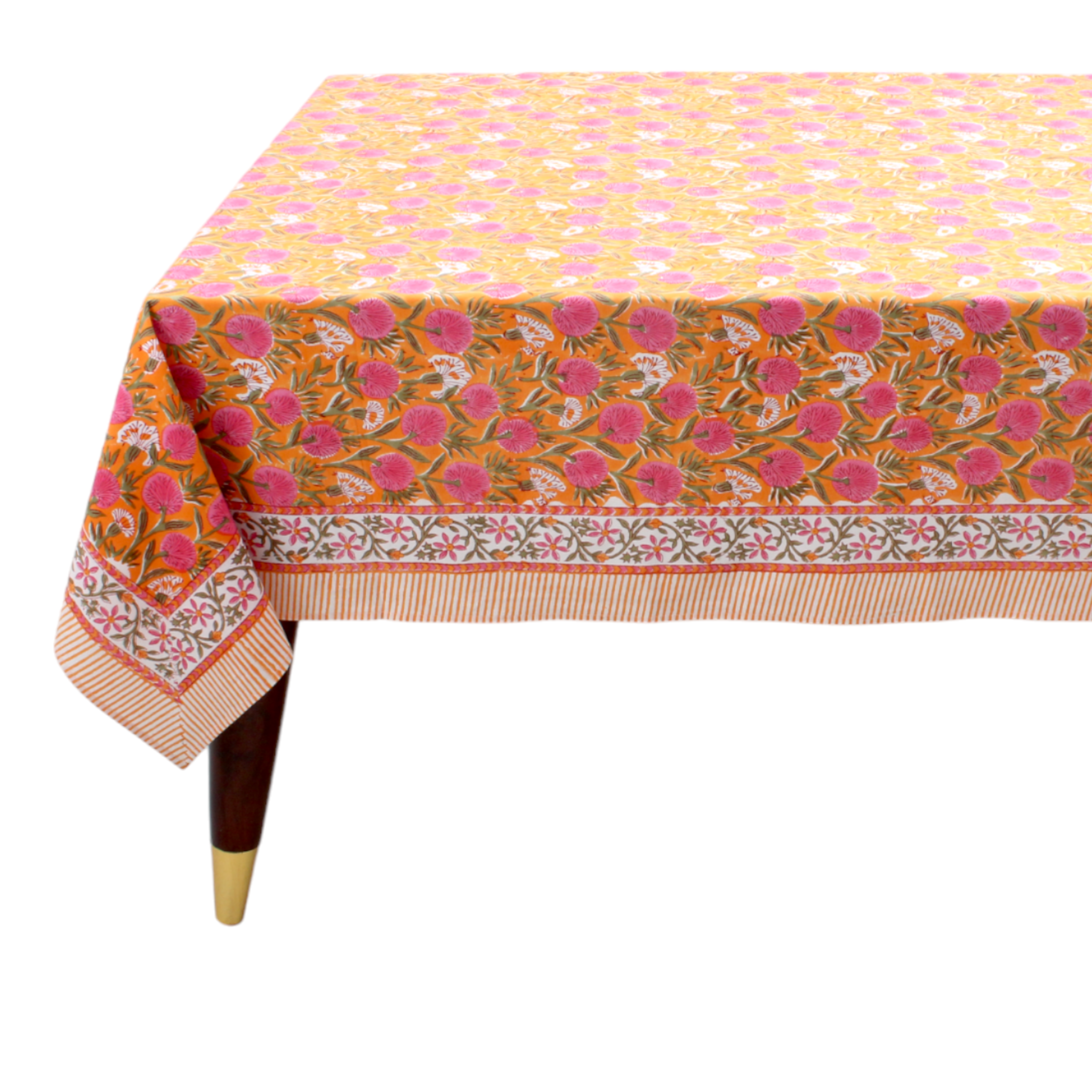 Colorful floral-patterned tablecloth on a wooden table with a white background