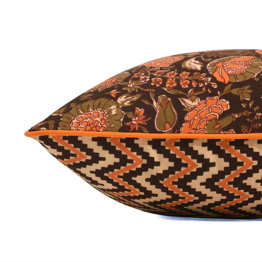 Decorative pillow with floral and zigzag pattern on a white background