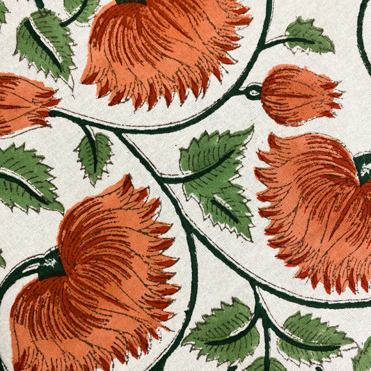 Pattern of orange flowers and green leaves on a white background