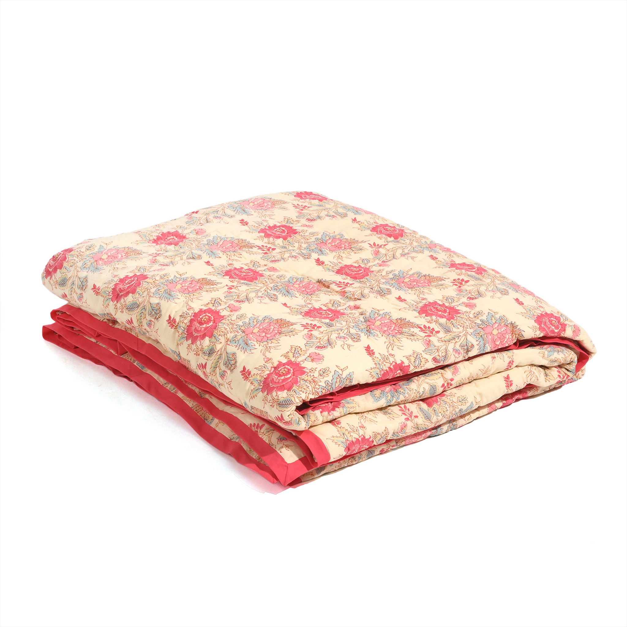 Floral quilt with red border on a white background