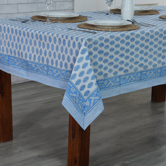 Tablecloth with blue floral pattern on a wooden table