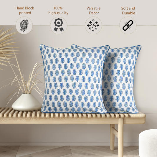 Two blue patterned pillows on a wooden bench with decorative elements and text about product features.