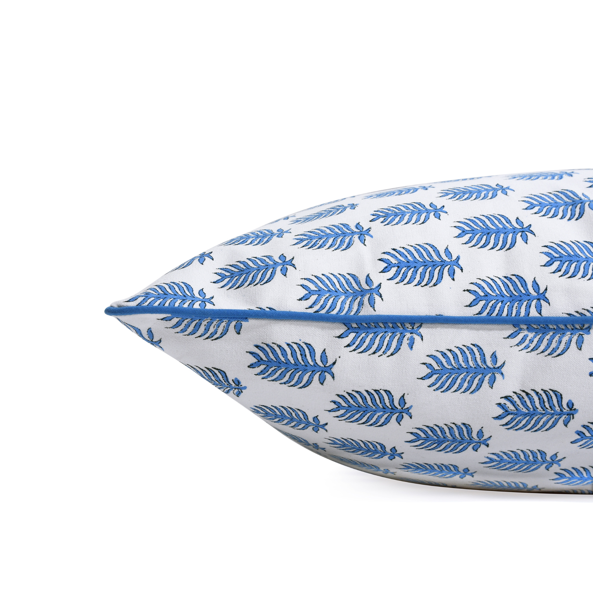 Decorative pillow with blue leaf pattern on a white background
