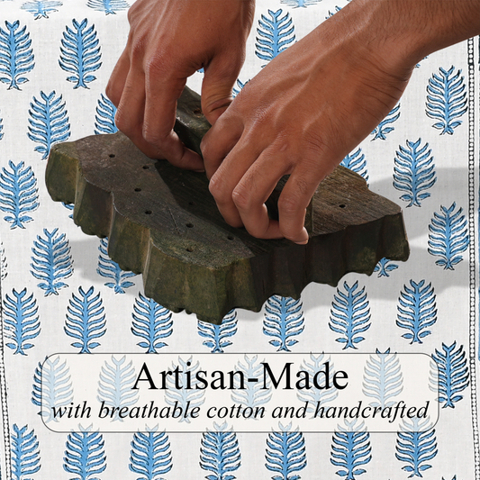 Hands working with a wooden tool on a patterned background with 'Artisan-Made' text.