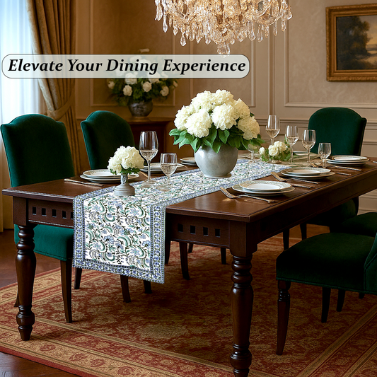 Dining room with a table set for dinner, flowers, and a chandelier.