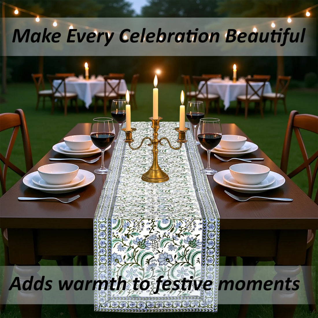 Dining table set with a decorative table runner, candles, and wine glasses outdoors.