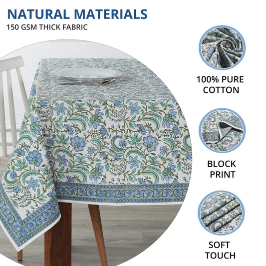 Floral patterned tablecloth on a table with natural materials text and images.