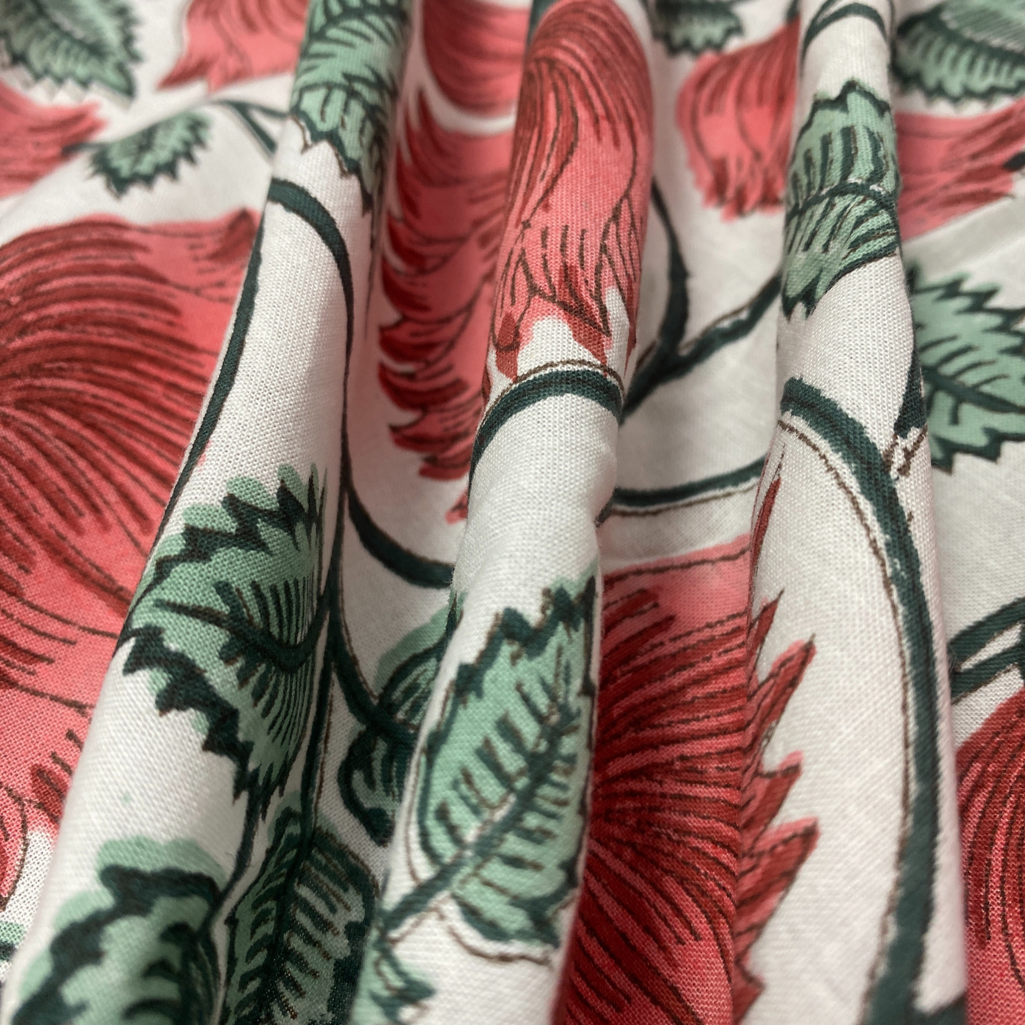 Close-up of fabric with red and green leaf pattern
