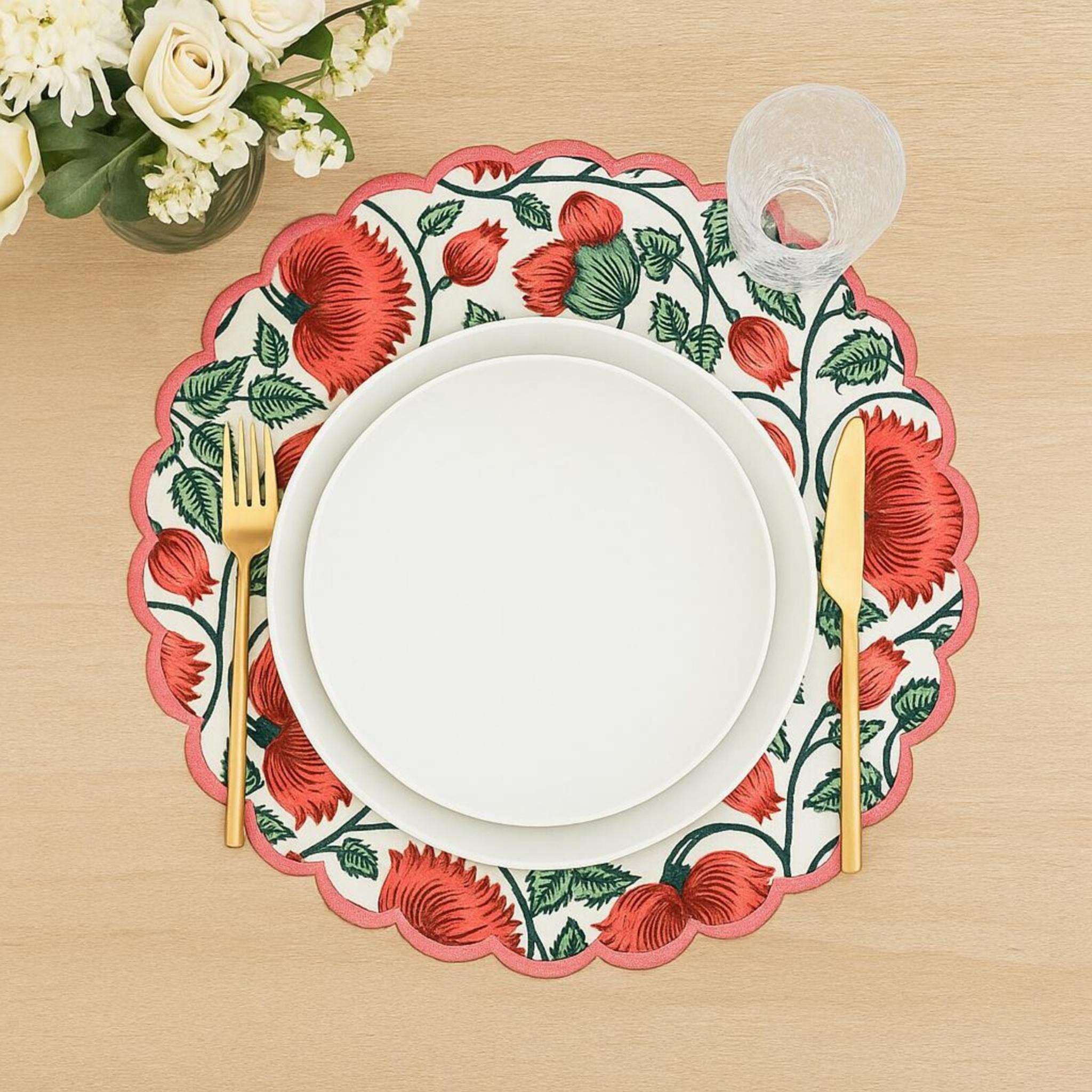 Floral placemat with red flowers on a wooden table