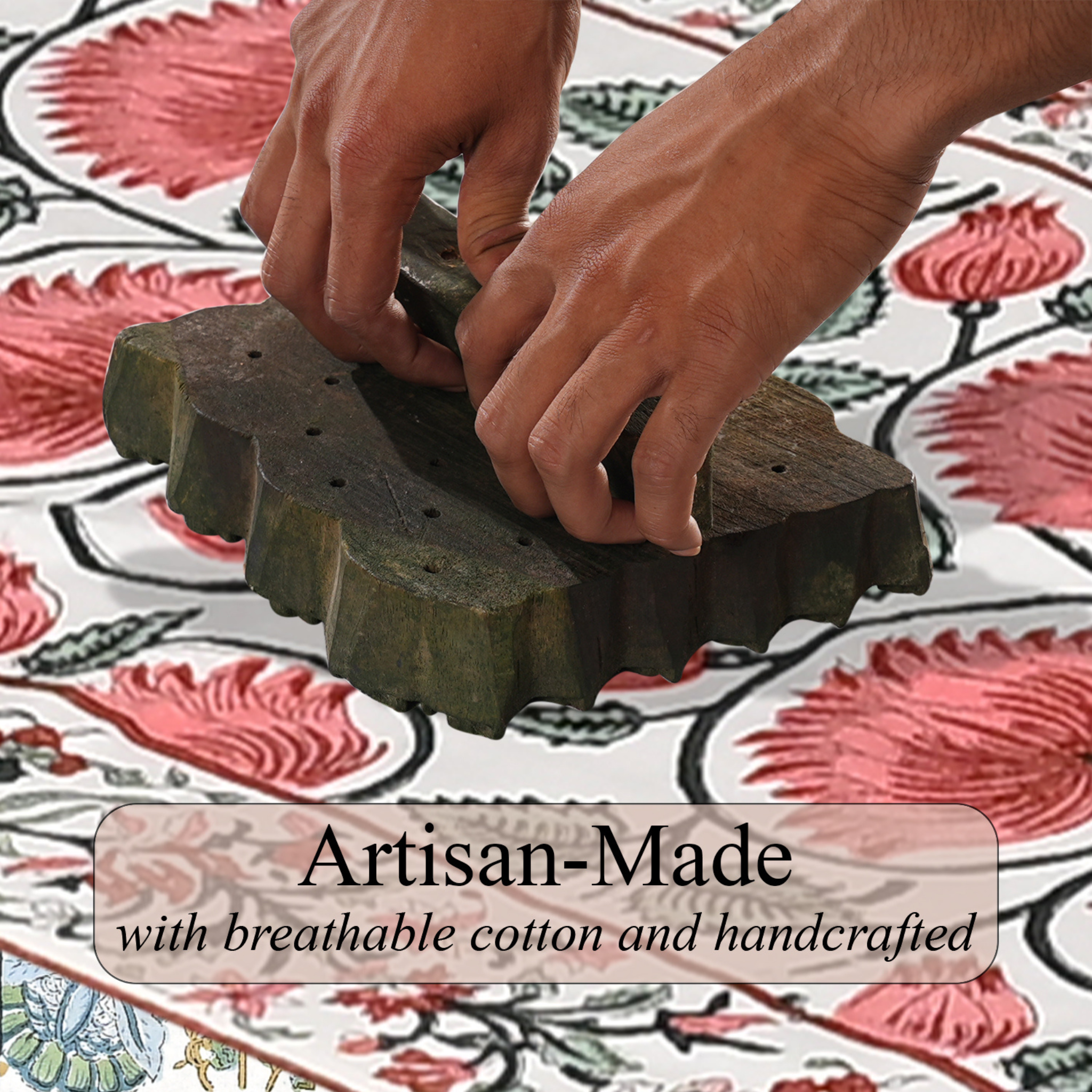 Hands using a wooden block printing tool on fabric with floral patterns.