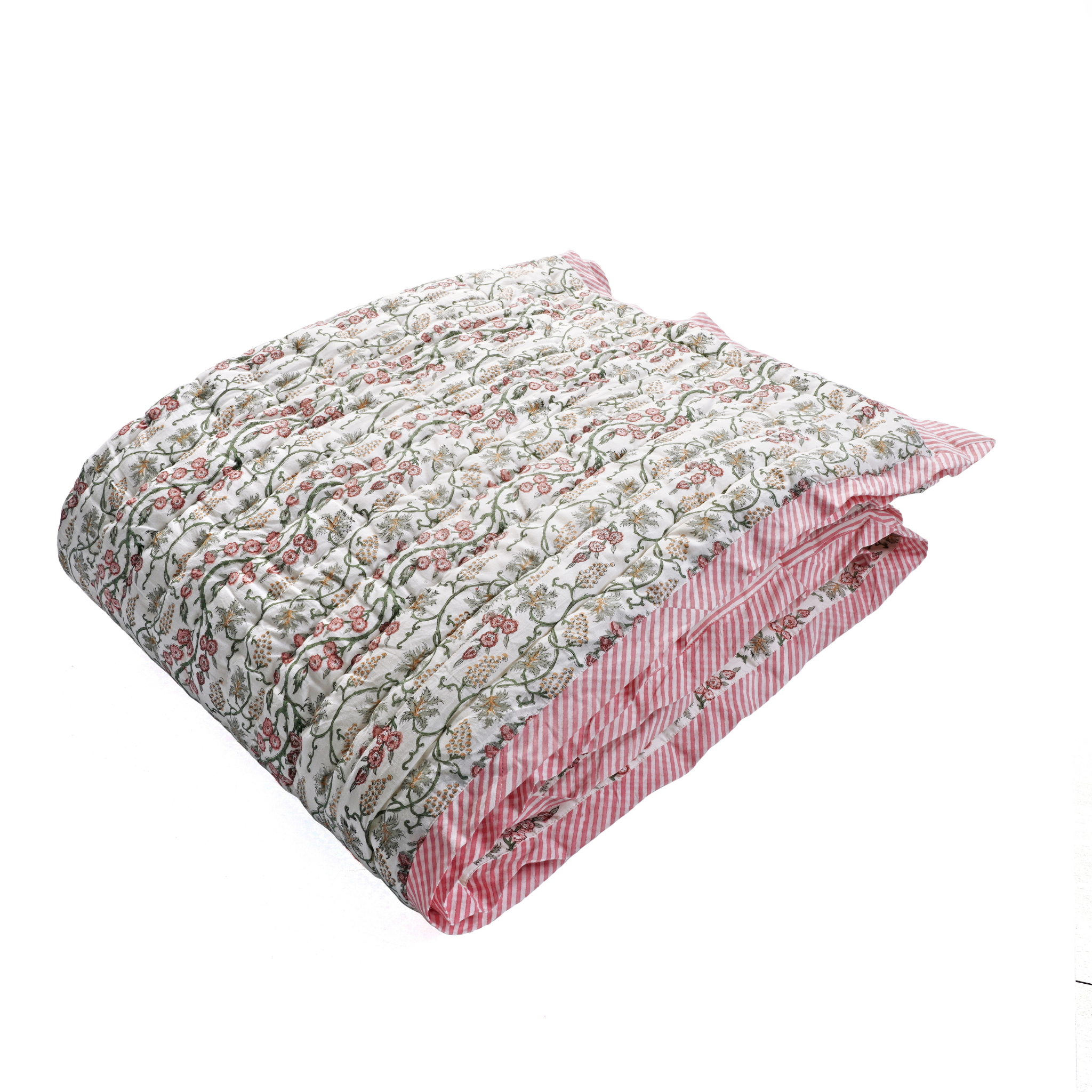 Floral patterned quilt with red and white stripes on a white background