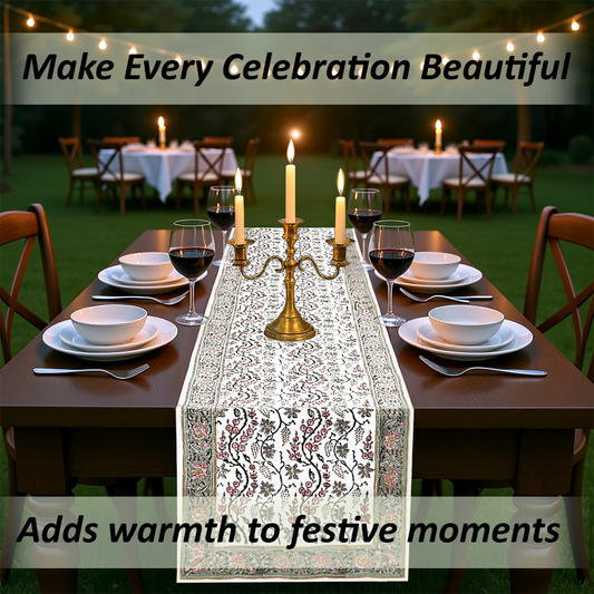 Dining table set with a decorative table runner, candles, and wine glasses outdoors.